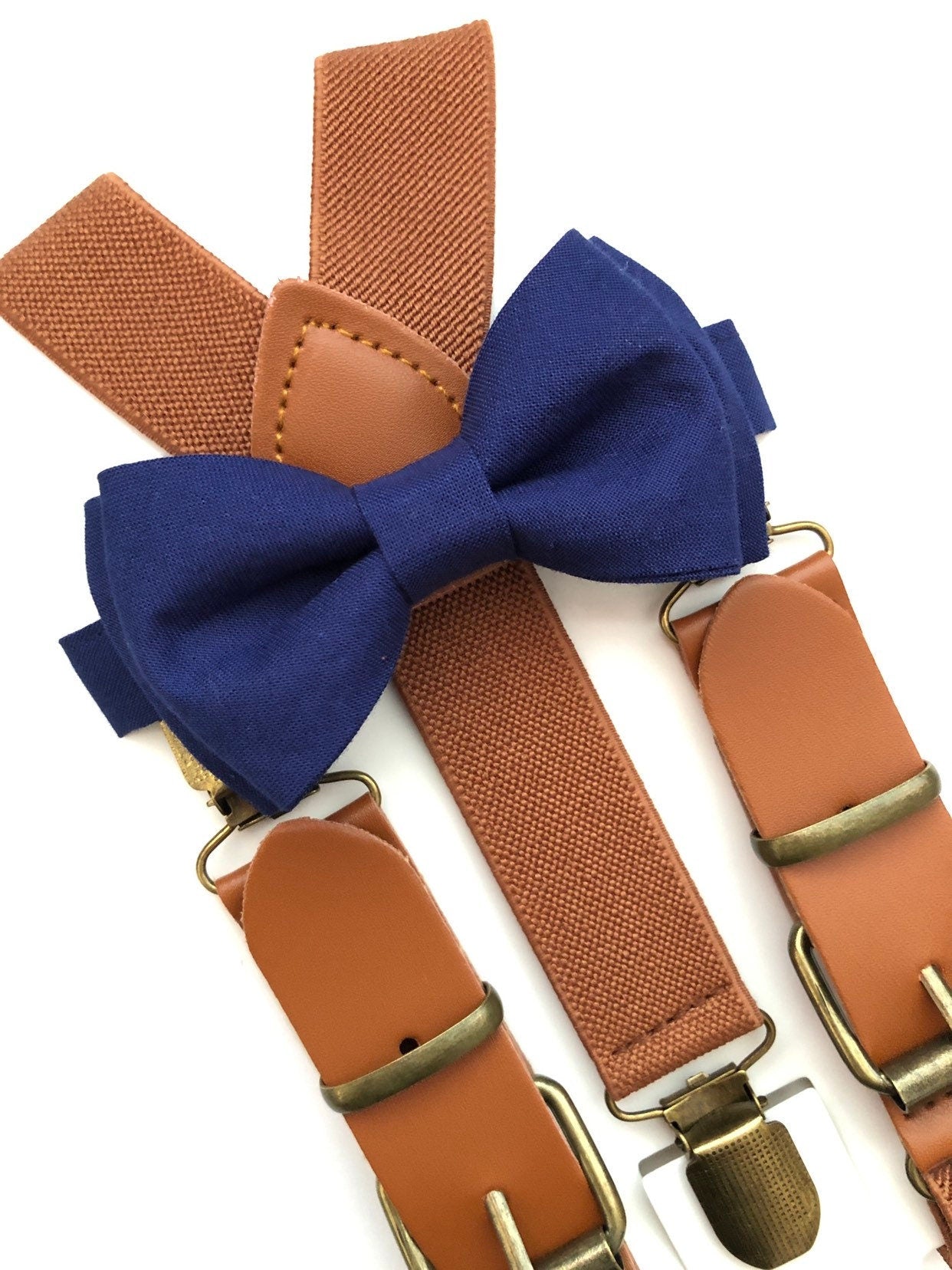 Brown Elastic Buckle Cognac Suspenders and Navy Blue Bow Tie.