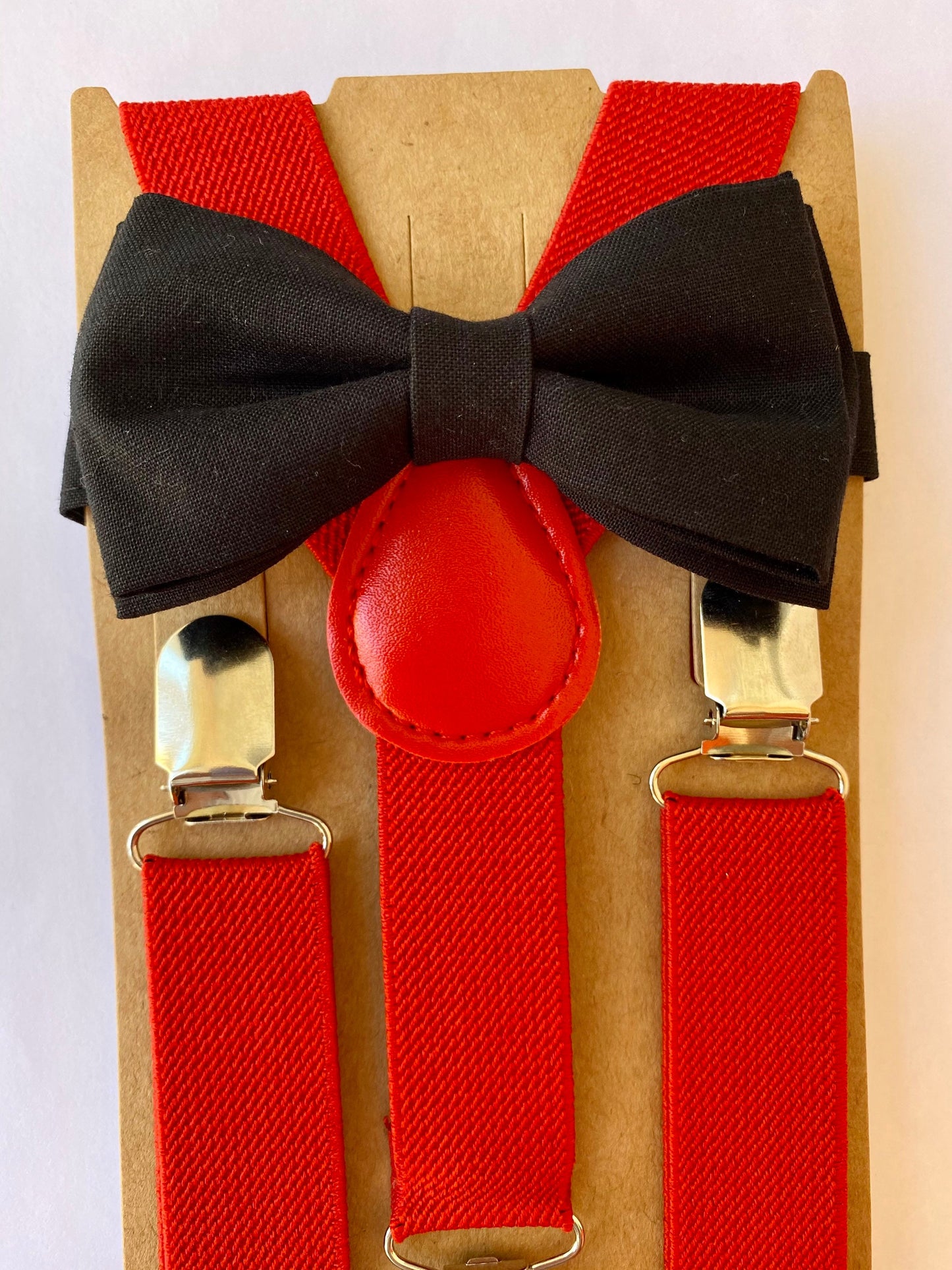 Black Bow Tie and Red Suspenders.